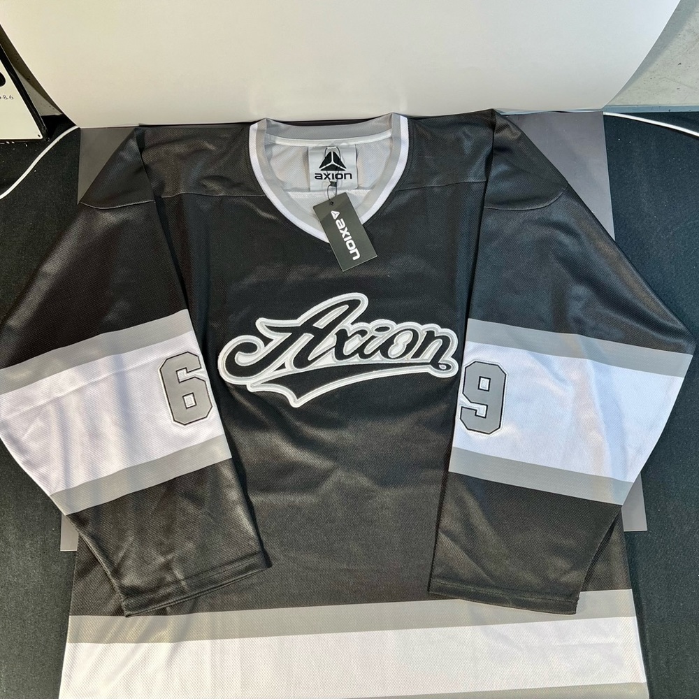 Axion Footwear Jersey in Black and Silver. Size XL. Brand New With Tags